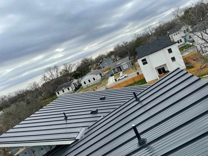 Standing seam metal roof panels with vents for Skylight Repair in Des Peres